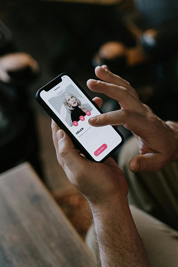 dating app, smartphone, close-up hands, online dating, modern technology, indoor setting, contact profile, Helen, user interface, app interaction, touchscreen