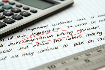 competitive pricing, handwritten text, business notes, calculator, pricing strategy, encircled text, paper, focused image, multi-word terms, SEO keywords, handwritten notes