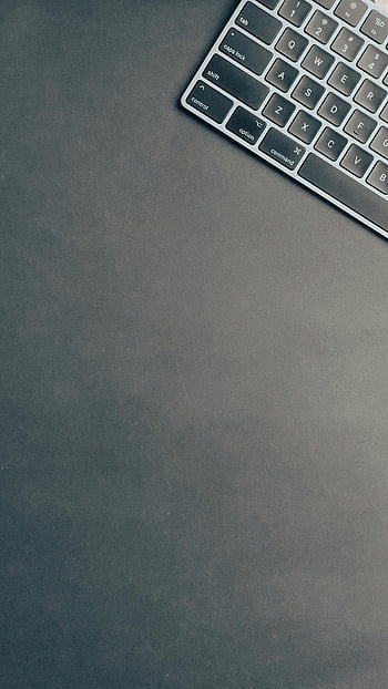 Apple Magic Keyboard, flatlay photography, black surface, sleek keyboard, tech-focused layouts, dark surface, minimalist design, modern keyboard, Apple keyboard, tech accessories, flat lay