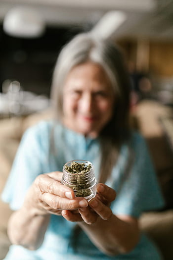 senior woman, glass jar, cannabis, legal marijuana use, dry leaves, glass container, senior, marijuana, legal cannabis, elderly woman, medical marijuana