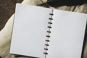 white sketch book, empty notebook, vintage quill pen, ready for notes, blank pages, artistic supplies, writing tools, creative journal, notebook design, quill pen writing, notebook inspiration