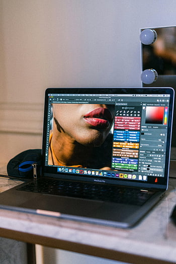 graphic design software, laptop screen, creative workspace, Adobe Photoshop, MacBook Pro, graphic interface, design tools, workspace setup, digital art, photo editing, software interface