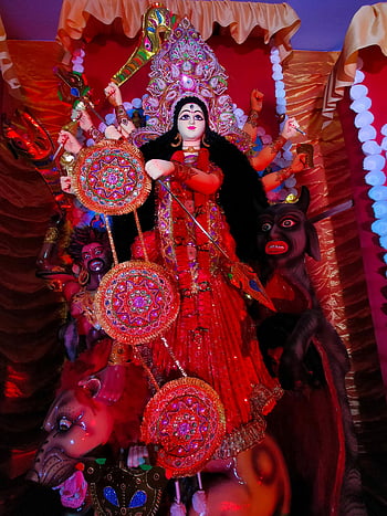 Goddess Durga, Durga Puja festival, vibrant depiction, idol, India, festival, red attire, traditional, cultural, celebration, decoration