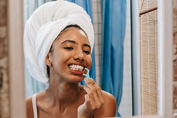 ethnic woman, dental floss, young woman, towel on head, flossing teeth, bathroom mirror, hygiene, wellness, personal care, oral health, self-care