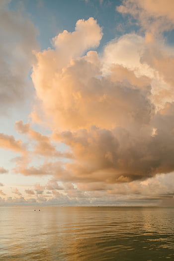 sunset sky, rippling sea, serene ocean, dramatic clouds, golden sunset, natural beauty, harmony, ocean view, sunset clouds, sea landscape, sunset seascape
