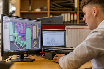 engineer, working, office, CAD software, dual monitors, computer, desk, technical design, 3D modeling, professional, workspace