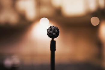 black microphone, microphone on stand, blurred background, music themes, speech themes, recording equipment, audio device, stage microphone, vocal microphone, performance microphone, studio microphone