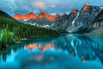 Moraine Lake, Banff National Park, sunrise reflections, serene beauty, mountain lake, Canadian Rockies, natural landscape, outdoor scenery, tranquil waters, alpine environment, morning light