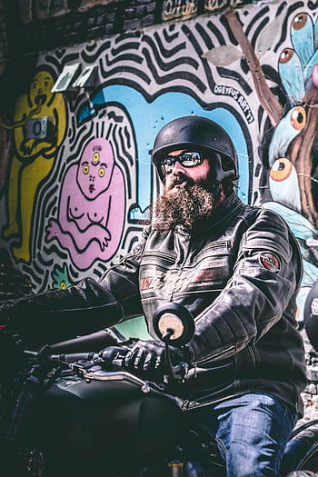 motorcyclist, leather jacket, vibrant graffiti, urban art, rugged biker, black motorcycle, graffiti wall, biker style, urban scene, motorcycle rider, leather gear