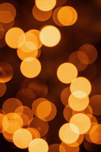 orange bokeh, blurred lights, abstract background, warm tones, defocused lights, orange circles, bokeh effect, soft focus, warm background, bokeh photography, orange glow