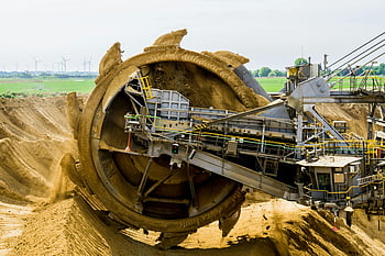 bucket wheel excavator, open pit mine, heavy equipment, sand, green landscape, mining machinery, industrial machinery, excavation, metal equipment, construction equipment, mining industry