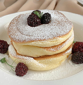 Japanese pancakes, blackberries, powdered sugar, fluffy pancakes, sweet breakfast, close-up photo, pancake stack, dessert, breakfast food, fruit topping, powdered sugar topping