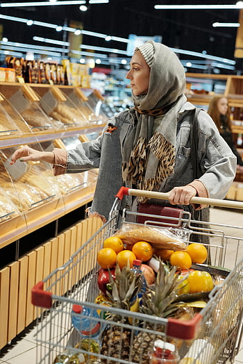 woman in hijab, buying groceries, Muslim woman, shopping, bread, fruits, supermarket, hijab, grocery cart, fresh produce, supermarket aisle