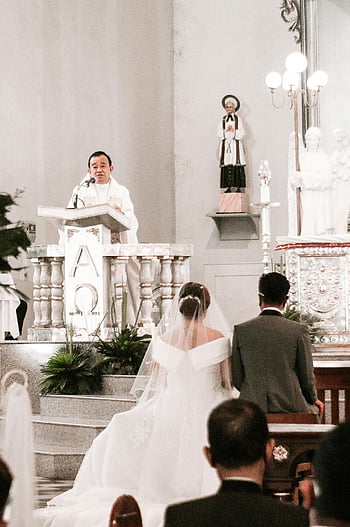 priest, wedding ceremony, church, bride, groom, church altar, wedding dress, priest at podium, religious ceremony, church interior, wedding guests