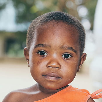 Boy, Looking Straight Ahead, Adorable, Young Child, Outdoors, Dar es Salaam, Tanzania, Innocence, Curiosity, Close-up, Photo