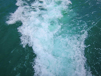water passed by boat, turquoise ocean, white foam, ocean waves, aerial view, boat wake, sea surface, water texture, ocean scenery, marine landscape, wave patterns