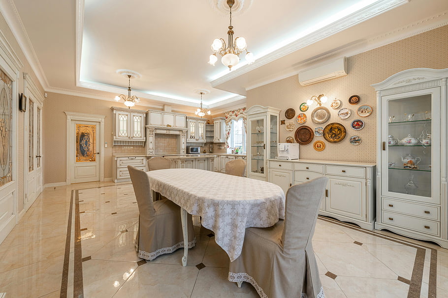 luxurious dining room, vintage ceramics, classic furniture, ornate room, chandelier, marble floor, white cabinets, decorative plates, dining table, elegant interior, vintage decor