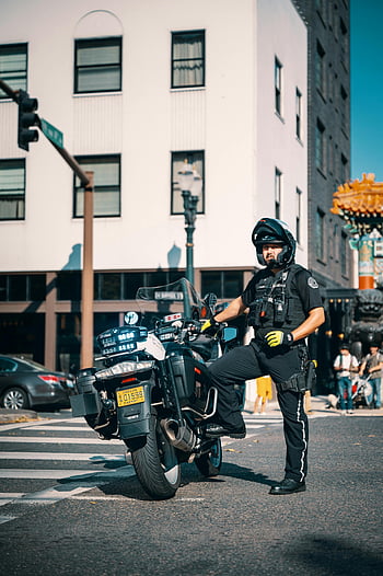 policeman, uniform, motorcycle, urban setting, street safety, police officer, city street, traffic enforcement, law enforcement, public safety, motorbike patrol