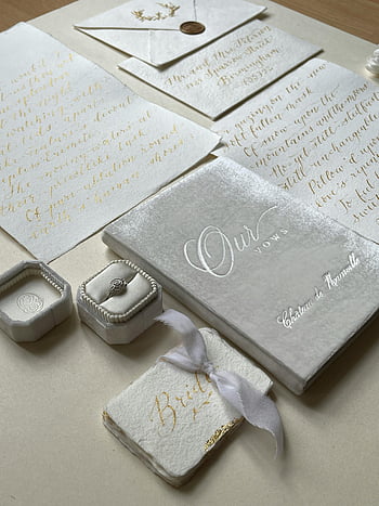 wedding rings, wedding vows, flat lay, romantic setting, elegant stationery, wedding stationery, ring box, vow book, gold calligraphy, wedding invitation, romantic table setting