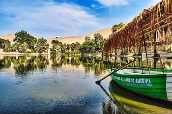 Huacachina oasis, green boat, desert lake, palm trees, sand dunes, Ica Peru, tranquil view, reflections, desert oasis, Huacachina lagoon, desert landscape