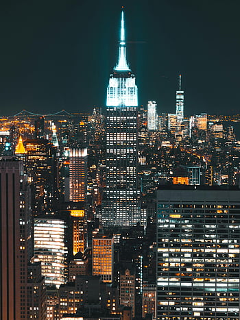 Empire State Building, New York City skyline, nighttime cityscape, illuminated buildings, urban night view, city lights, skyscrapers at night, night photography, stunning city view, Empire State Building lights, New York night scene