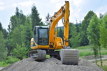 yellow excavator, gravel pile, lush green forest, Poland, construction equipment, outdoor machinery, heavy machinery, forest setting, excavator in forest, yellow construction vehicle, gravel site