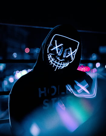 neon mask, black pullover hoodie, Dominican Republic nightlife, vivid lights, mysterious person, night scene, urban setting, glowing mask, street style, hooded figure, nightlife atmosphere