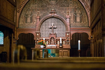 church altar, cross, candles, floral arrangement, detailed view, beautifully decorated, interior, religious, sacred space, wooden architecture, stained glass