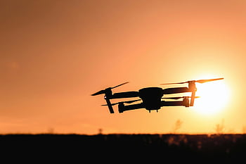 drone, silhouette, camera drone, mid air, vibrant orange sunset, modern technology, aerial photography, sunset sky, drone photography, sunset drone, technology photography