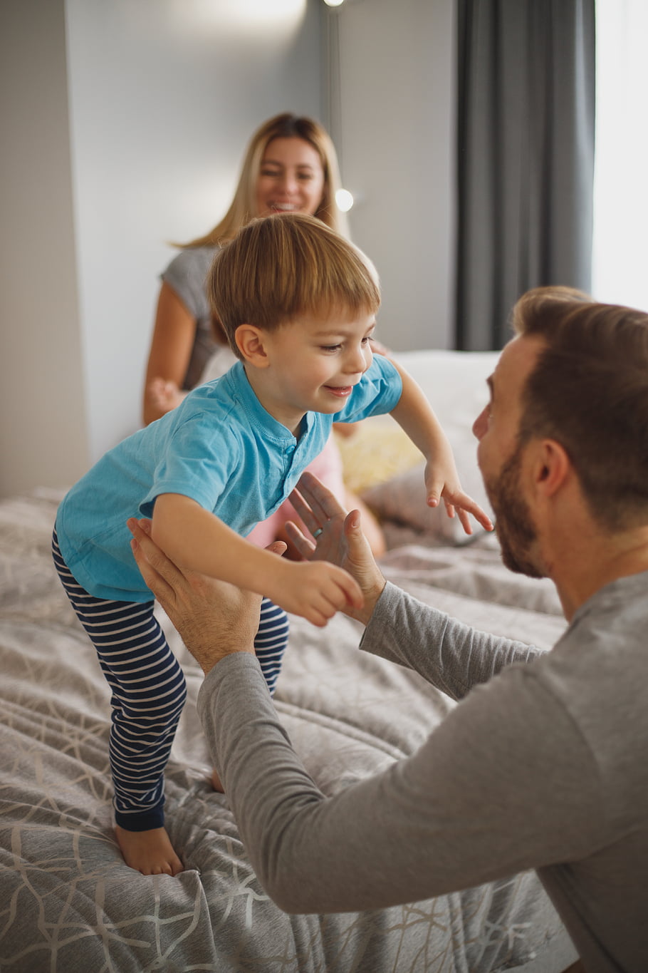family, jumping, bed, play, bedtime, boy, child, father, mother, people, indoors