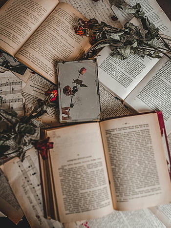 dried roses, old books, vintage books, sheet music, nostalgic vibe, aesthetic top view, dried flowers, book arrangement, vintage aesthetics, literary decor, music notes