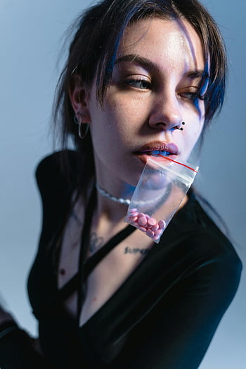 woman, biting, sachet, drugs, young, pills, ziplock bag, addiction, conceptual portrait, themes