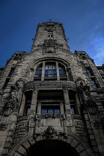 Gray Church, Gothic architecture, stone facade, carvings, sculptures, low angle view, historic building, architectural details, stone building, ornate design, clock tower
