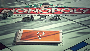 Monopoly, board game, metal tokens, dice, warm light, close-up, game pieces, Monopoly board, property trading game, classic game, tabletop game
