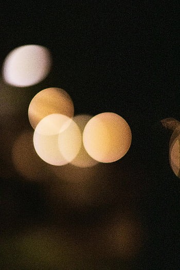 abstract bokeh, overlapped lights, evening backdrop, soft focus, bokeh circles, warm tones, dark backdrop, atmospheric effect, bokeh photography, night lights, abstract photography