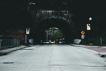urban road, tunnel, cars, traffic signs, speed signs, daytime, quiet road, visible traffic, speed limit, road under tunnel, urban tunnel