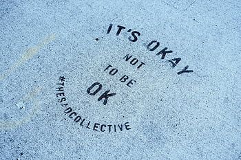 inspirational message, blue concrete pavement, Toronto pavement, close-up, It's Okay Not To Be Ok, mental health, street art, urban message, pavement art, motivational quote, TheSanCollective