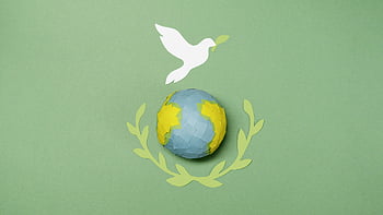 peace, dove, globe, paper cutouts, olive branches, green surface, conceptual image, world peace, paper art, environmental symbol, harmony