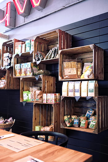 wooden boxes, eco market, eco-friendly shelves, organic products, trendy urban cafe, wooden crates, organic food display, sustainable packaging, natural products, cafe interior, urban market