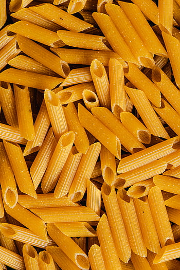 penne pasta, uncooked pasta, close-up photograph, detailed shot, food backgrounds, distinct texture, pasta texture, penne noodles, uncooked noodles, pasta photography, food photography