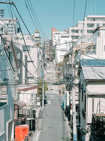 Tokyo residential street, narrow street, residential buildings, urban infrastructure, clear skies, peaceful street, blue sky, urban architecture, cityscape, Japan, residential area