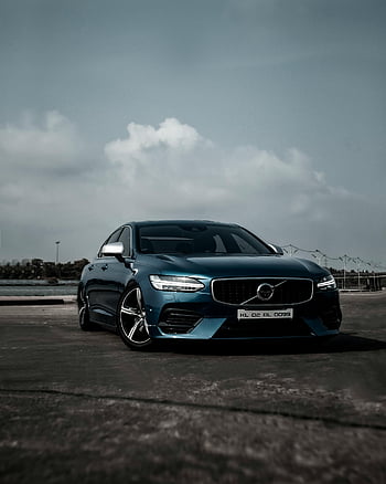 blue sedan, asphalt road, sleek design, cloudy sky, stylish car, parked car, automotive design, blue car, road vehicle, car photography, car showcase