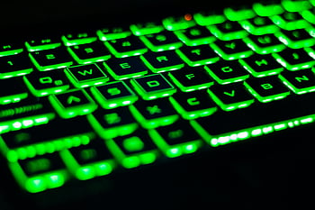 green and black keyboard, backlit keyboard, vibrant green keyboard, QWERTY layout, tech visuals, green keyboard, black keyboard, computer keyboard, gaming keyboard, keyboard photography, illuminated keyboard