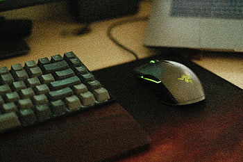 gaming mouse, mechanical keyboard, close-up photo, desk setup, illuminated mouse, Razer mouse, computer peripherals, gaming setup, close-up shot, desk surface, mouse pad
