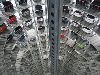 elevated parking lot, spiral car park, multi-storey parking, vehicles parked, vertical view, parking structure, car parking, multi-level parking, spiral parking, parking garage, vertical parking