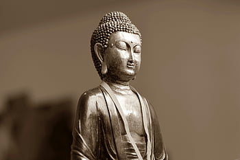 silver Buddha statue, serene Buddha, Buddhist spirituality, Buddhist art, close-up Buddha, spiritual art, Buddha figurine, religious statue, peaceful Buddha, spiritual figure, art sculpture