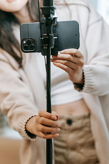 iPhone, tripod, smartphone, vlogging, close-up, woman, setting up, camera, mobile, content creation, video blogging