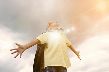 child, opening hands, sunlight, sky, lens flare, yellow shirt, cape, outdoors, freedom, joy, innocence