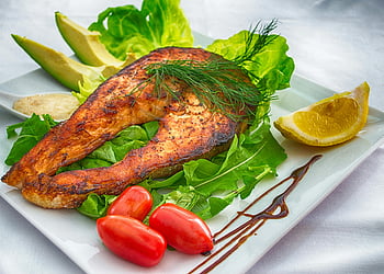 grilled salmon, fresh vegetables, herbs, white plate, delicious meal, healthy food, salmon dish, grilled fish, vegetable garnish, food photography, healthy eating