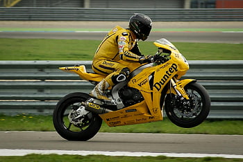 motorkerékpáros, sárga sportkerékpár, egykerekű, nagy sebességű verseny, szakmai pálya, dunlop, versenyruha, sisak, motorkerékpár versenyzés, versenypálya, sport motorkerékpár